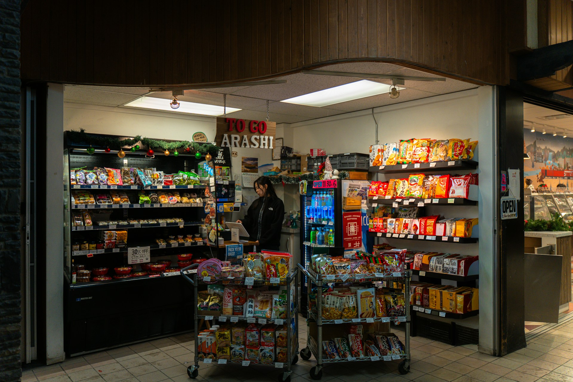 Retail counter and stocked shelves representing complex store operations